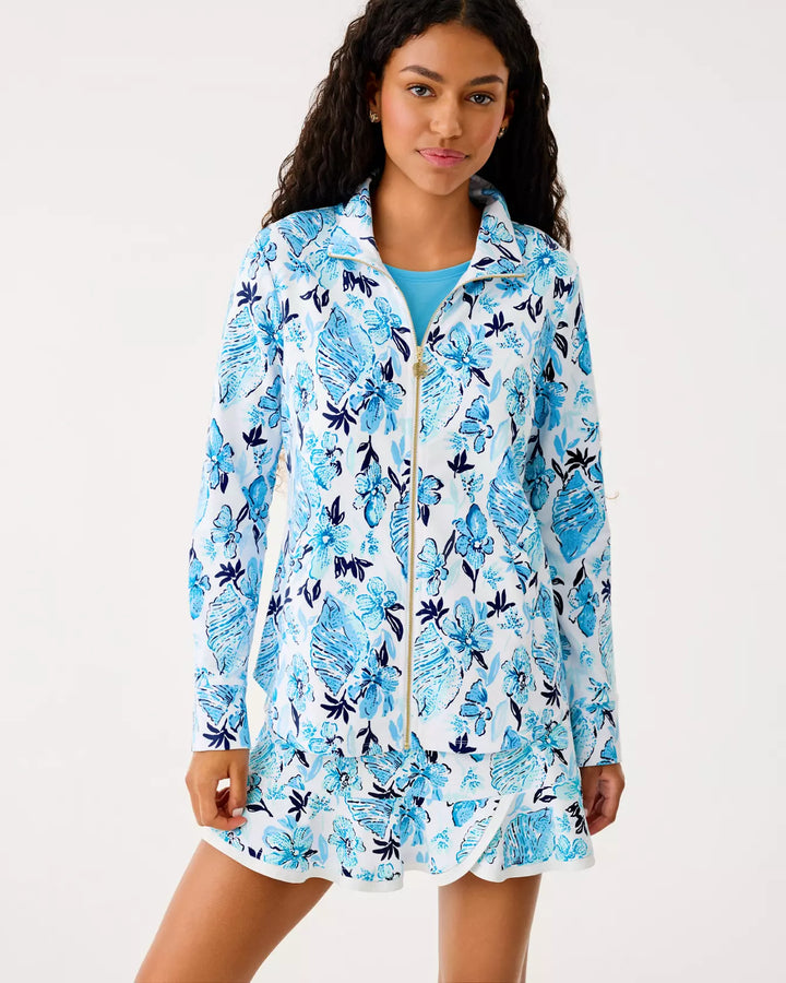 Woman wearing a blue floral patterned cover-up on a white background