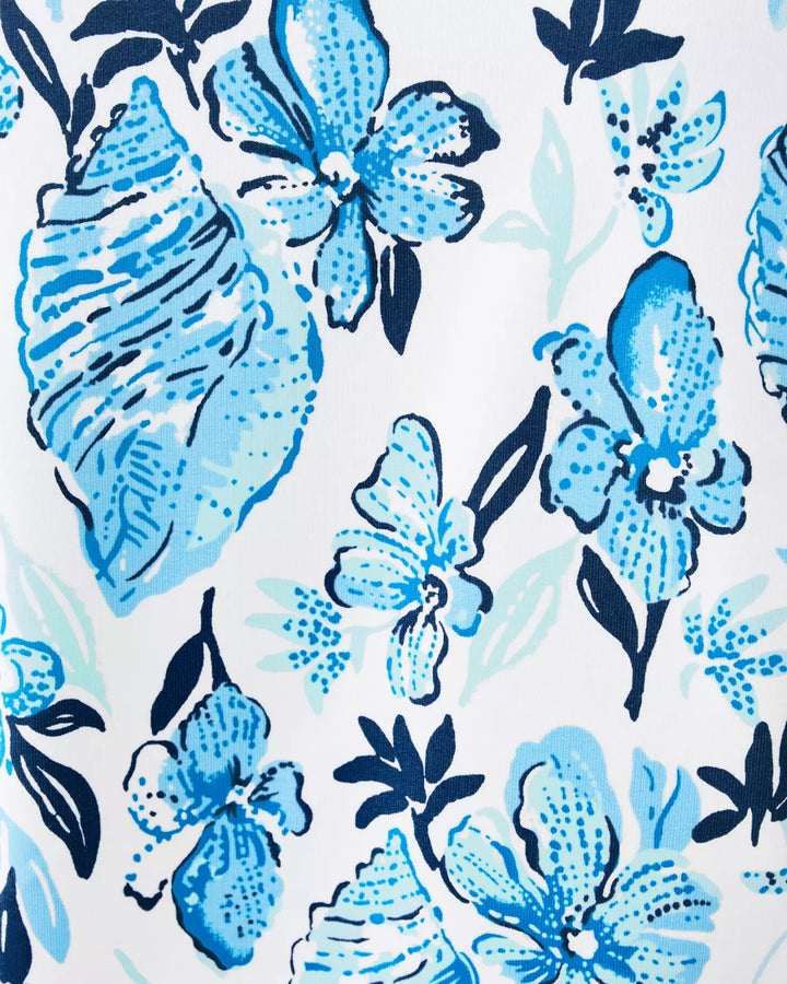 Pattern of blue flowers and shells on a white background