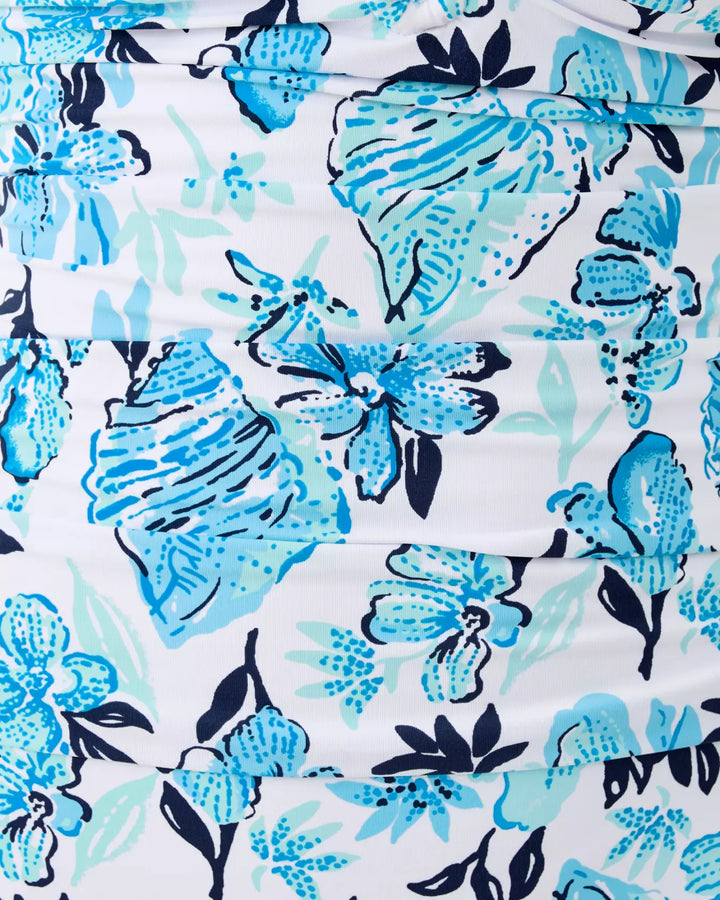 Floral patterned fabric with blue and black flowers on a white background