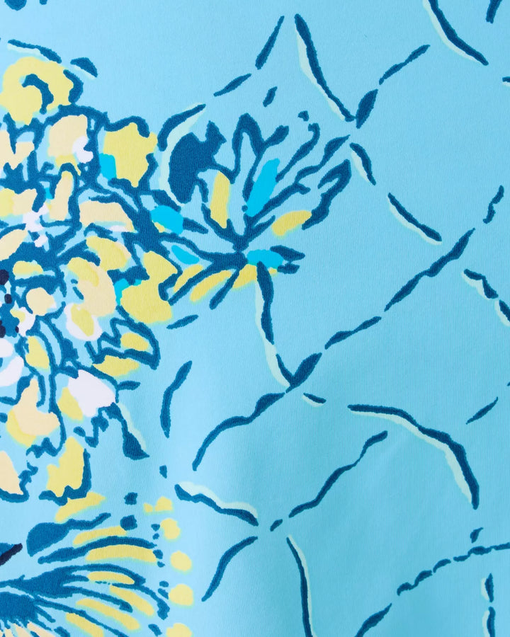 Close-up of a blue and yellow floral pattern on fabric
