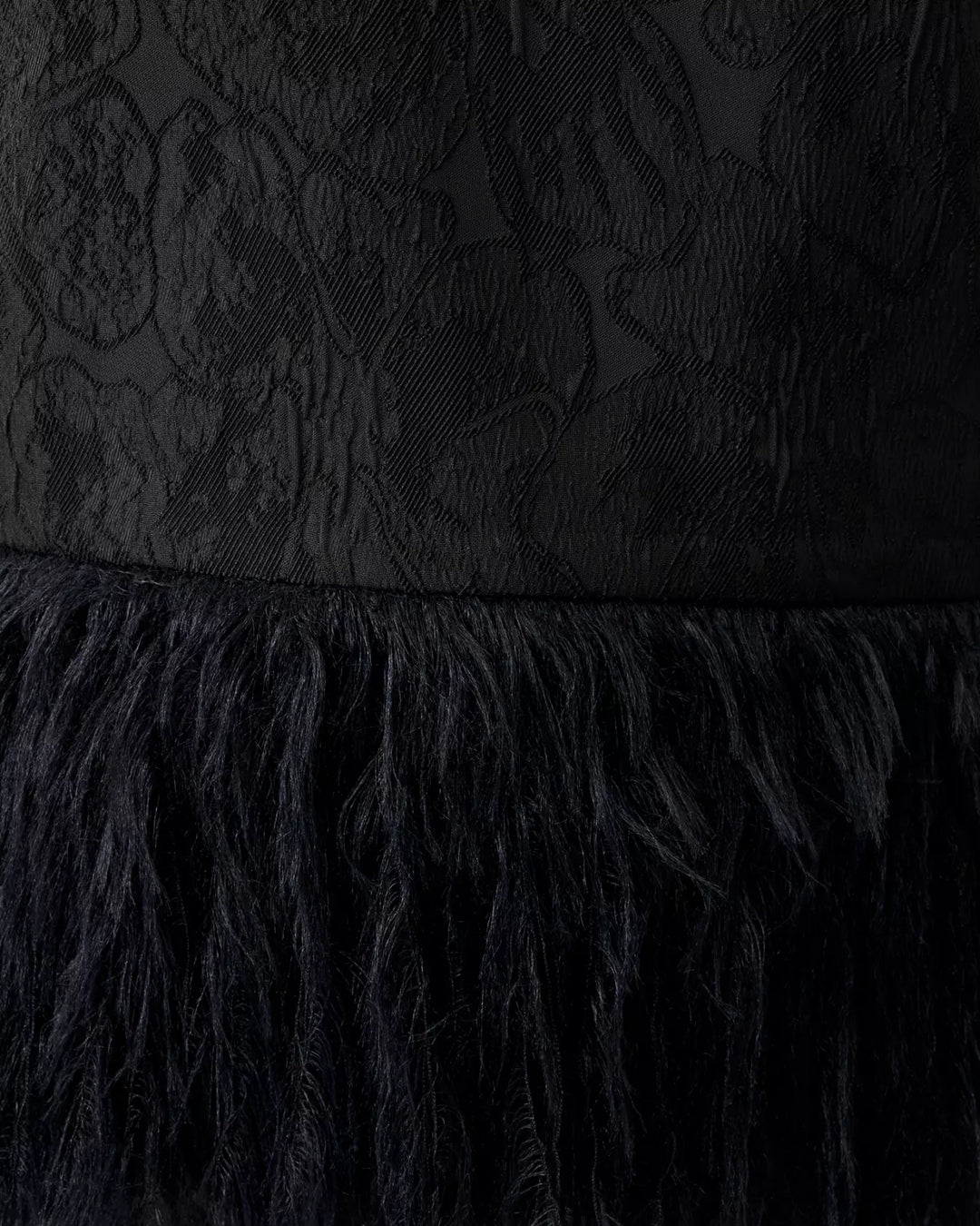 Black textured dress with feathered hem
