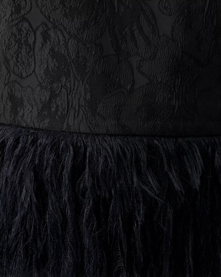 Black textured dress with feathered hem