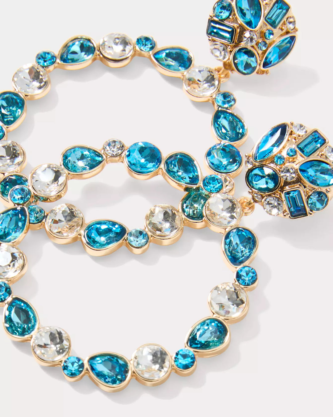 Necklace with blue and clear gemstones on a white background