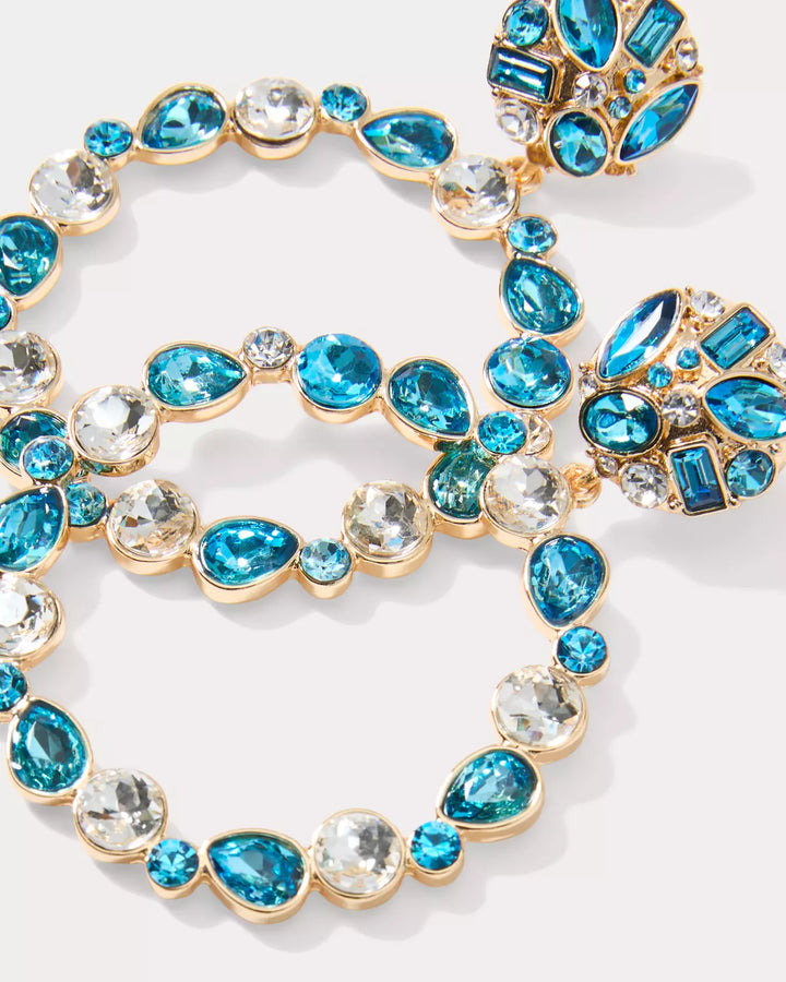 Necklace with blue and clear gemstones on a white background