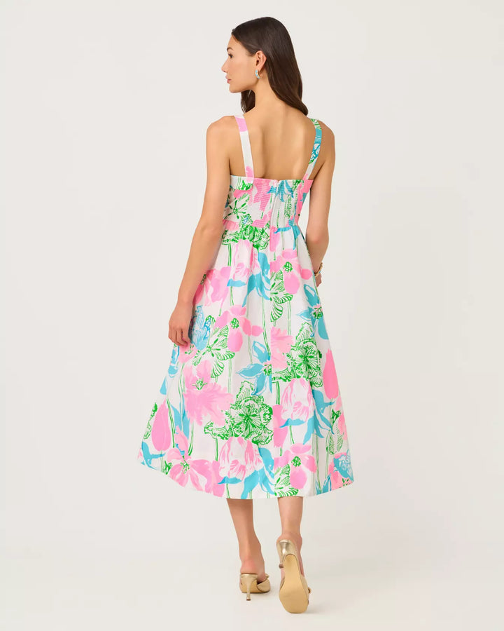 Woman wearing a floral dress on a white background