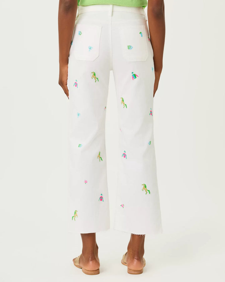 White pants with colorful embroidery on a white background