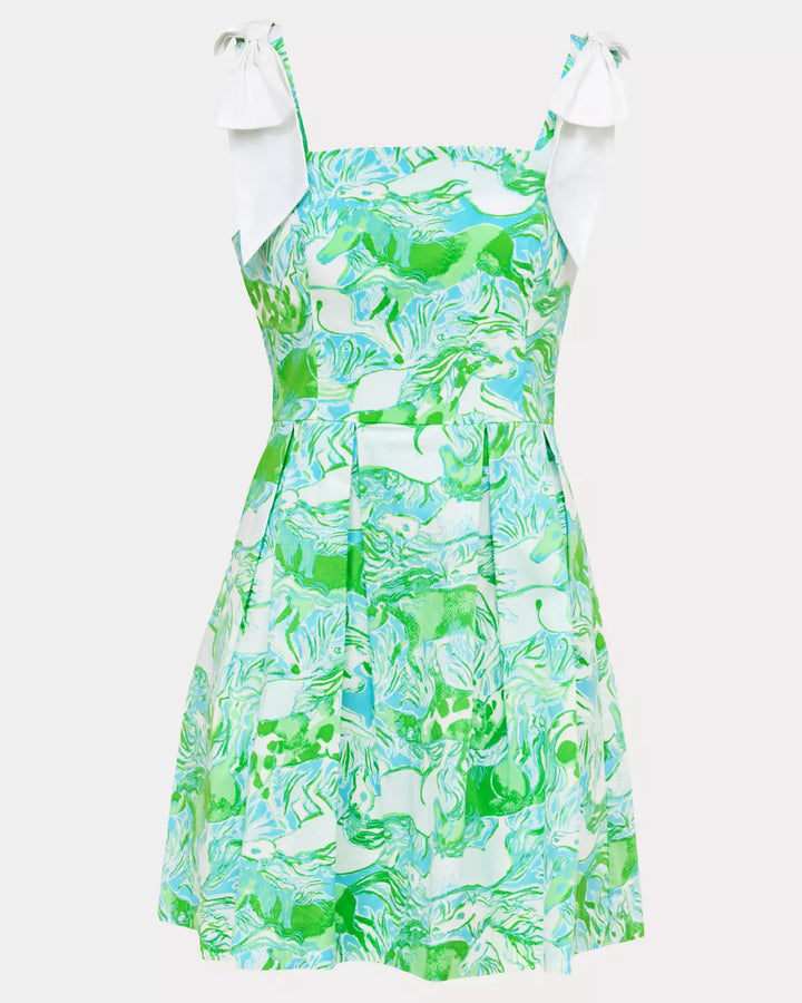 Green and blue patterned dress with white bow straps on a white background