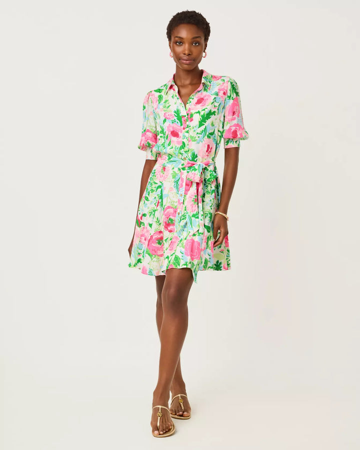 Woman wearing a floral dress on a white background